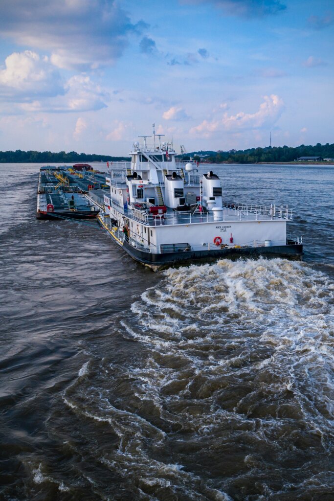 A boat sailing down the Mississippi river.