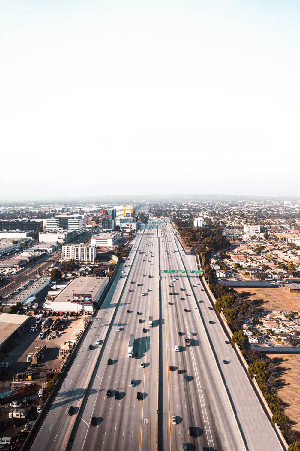 A view of a Los Angeles highway, showcasing the vast roads, plentiful lanes, and a prime location for car chases. 