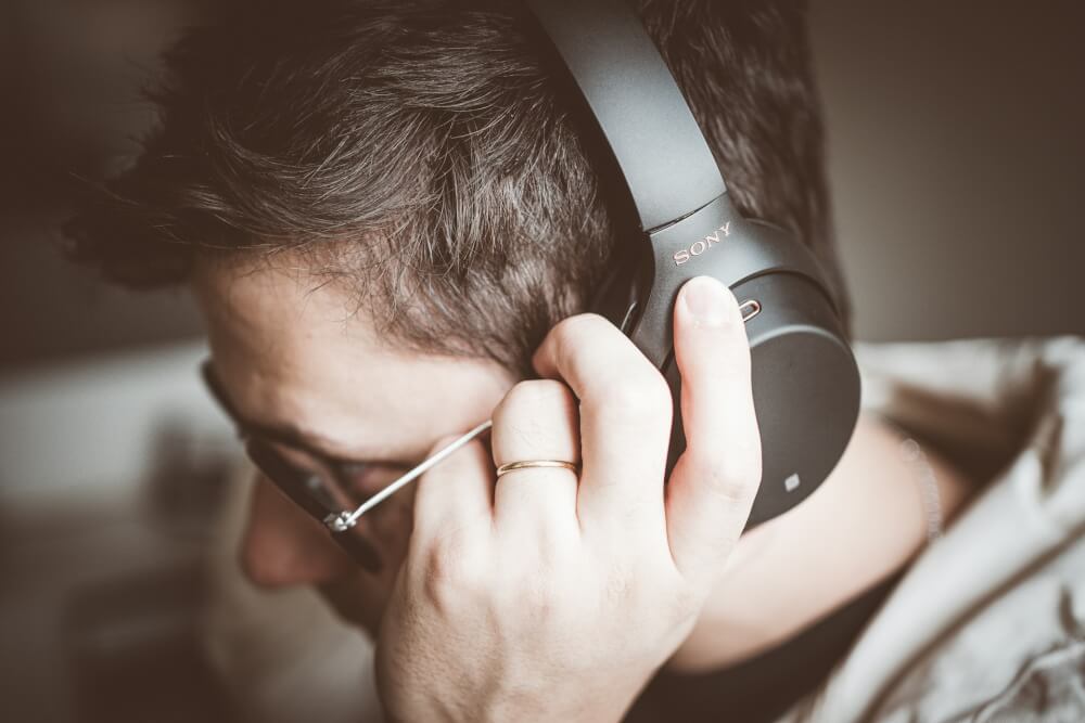 Man using noise cancelling headphones