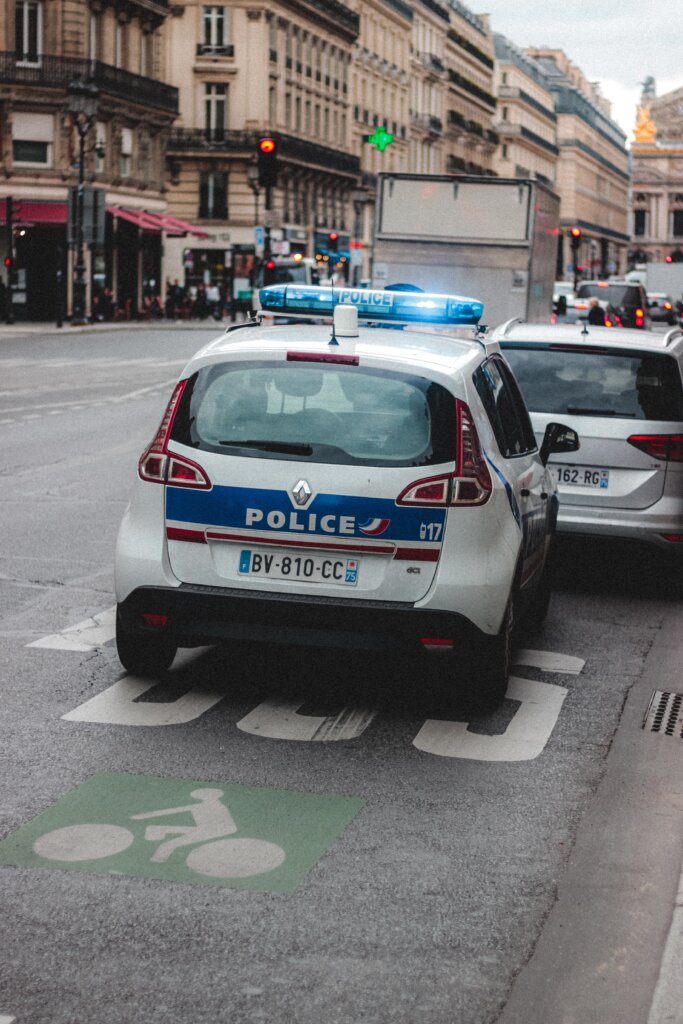 Police cars on the road in Paris