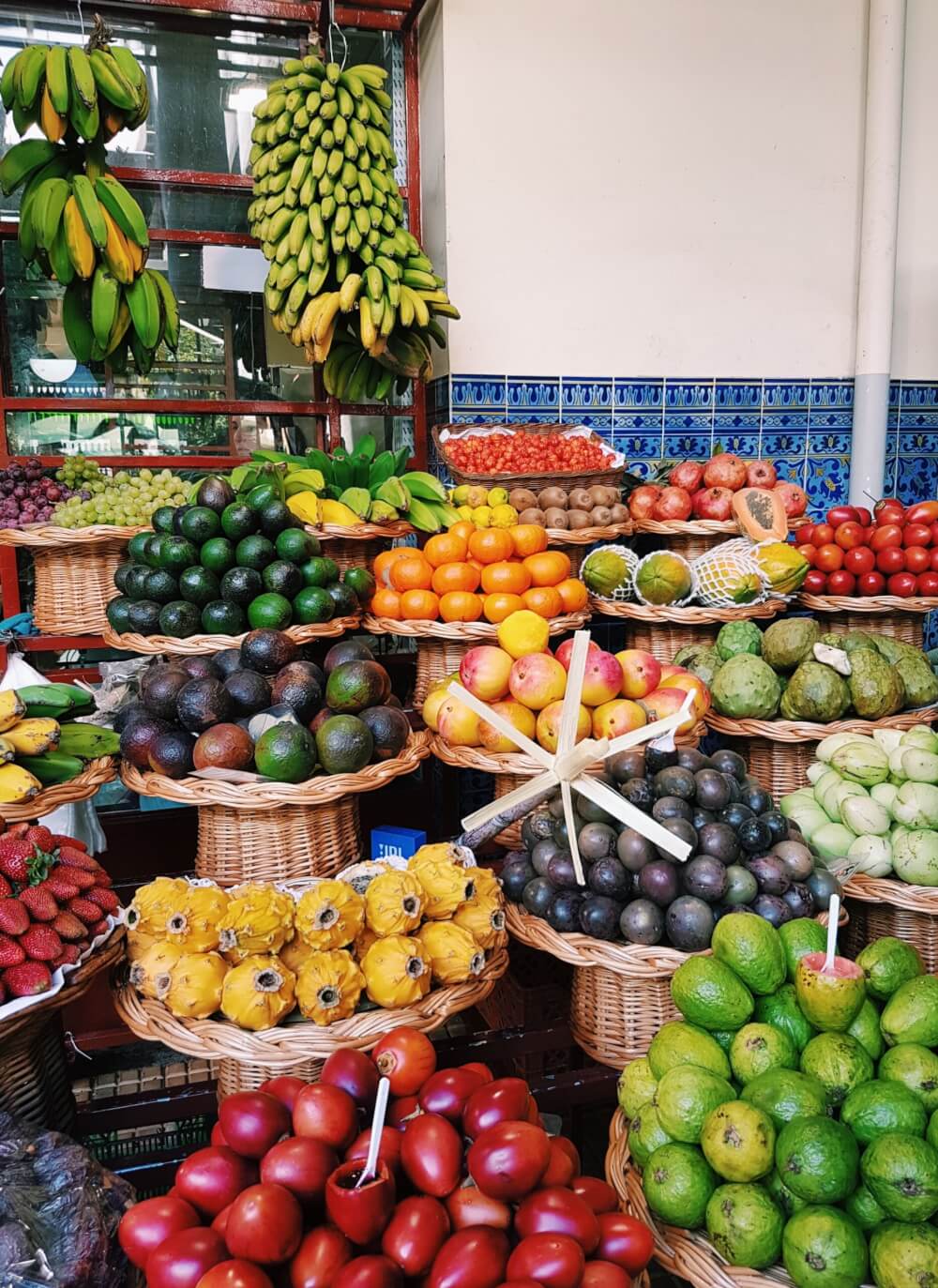 Platters of tropical fruit for sale at a market